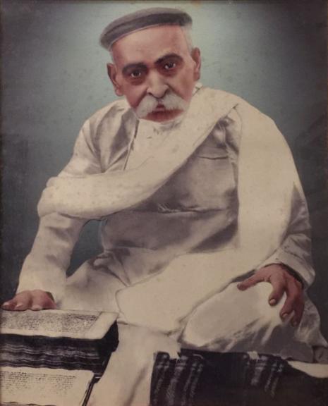 Tulsi Ram, 1838–1890, Great-grandson of Raja Harsukh Rai, reading Jain manuscripts