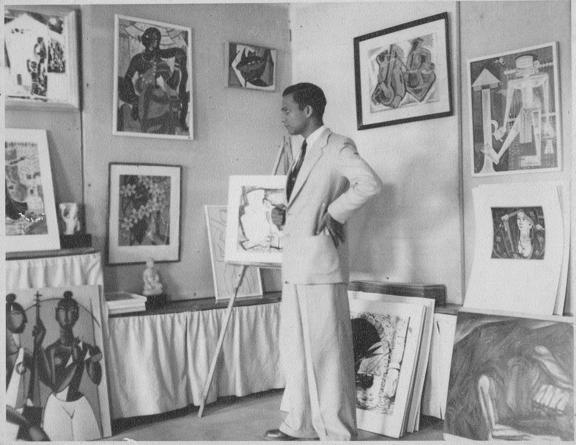 Virendra, 1958, at the Gallery with paintings by Husain, Satish Gujral, Biren De, Kulkarni, Santosh, Almelkar, Laxman Pai, and Krishna Reddy